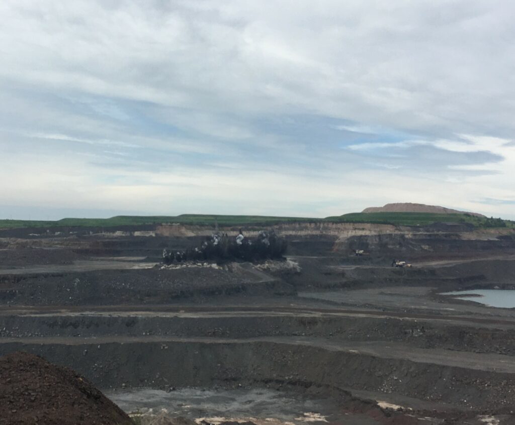 A blast within the Minntac mine viewed from a distance